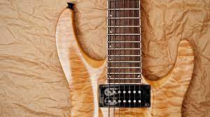 The wood of the electric guitar